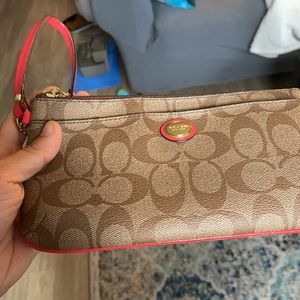 Coach large wristlet (tan, w/ red trim).